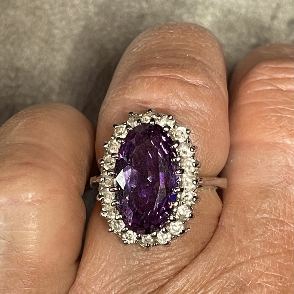 Purple Multi faceted stone surrounded by faux diamonds